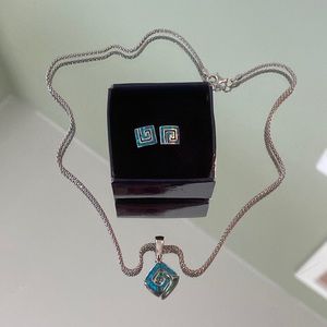 Sparkly blue swirl matching earring a and necklace